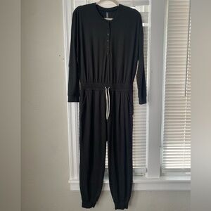 Vuori Lux Henley Jumpsuit Black Elastic Waist Tapered Leg Lounge Athleisure Cozy